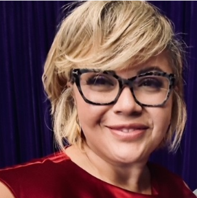 a person wearing glasses and a red dress